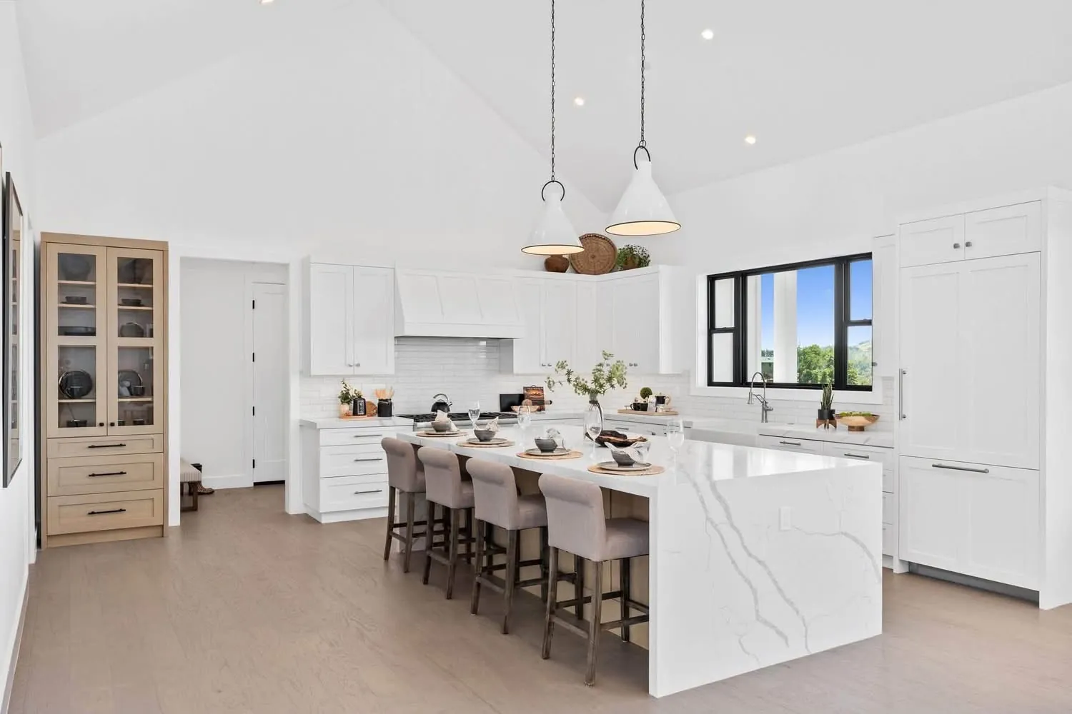 Vaulted kitchen with waterfall island